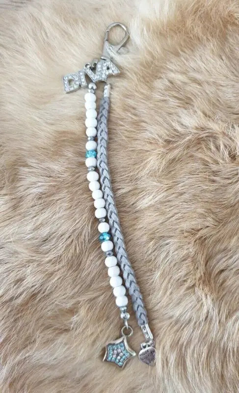 Diva sleutelhanger taupe / wit